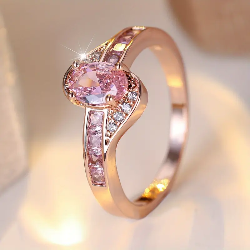 Anello dorato con cristallo rosa